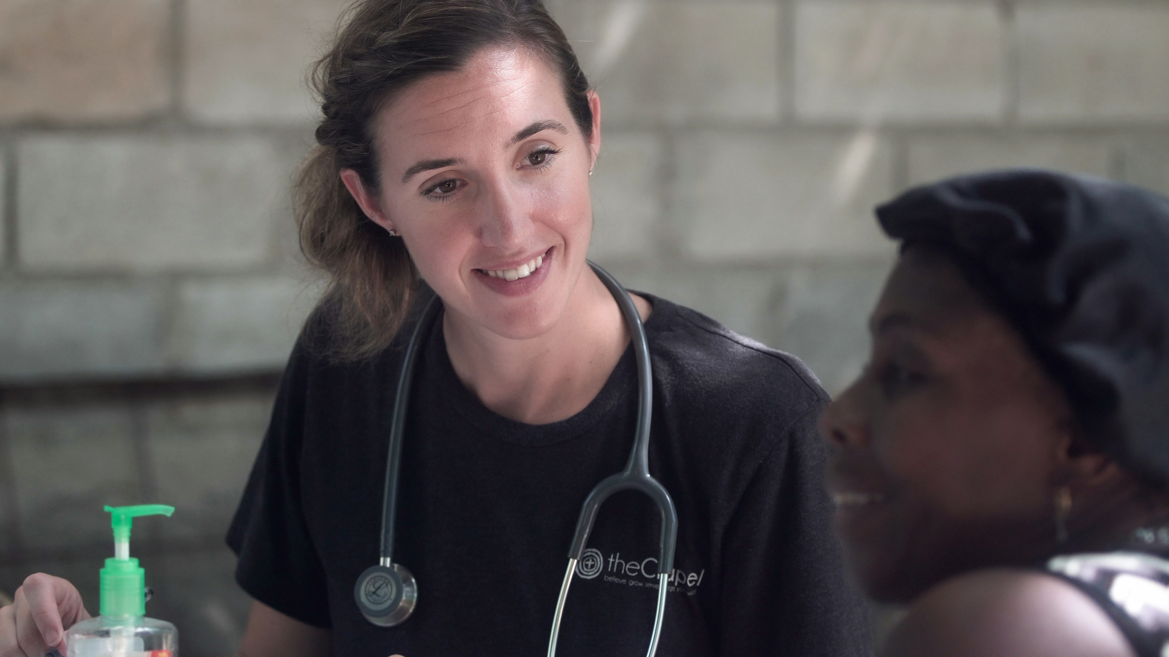 Diverse group of healthcare professionals collaborating over medical documents